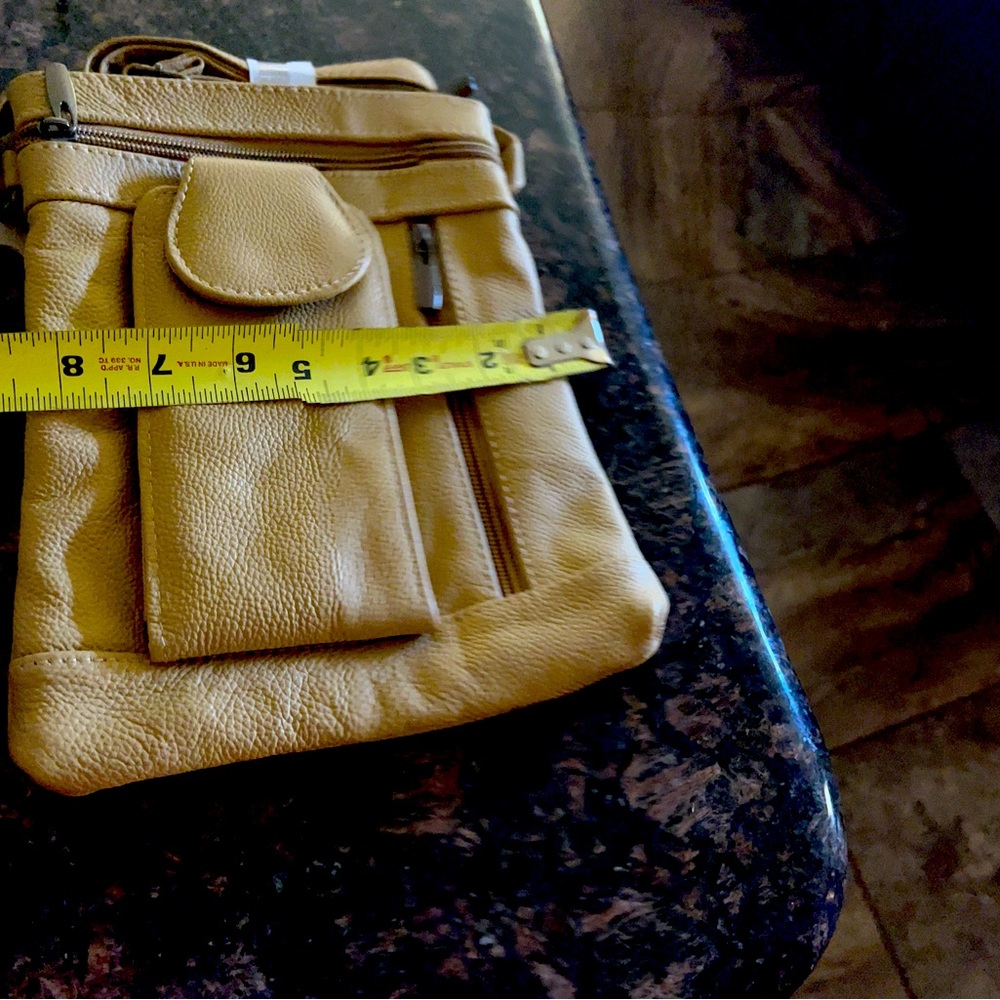 Small shoulder leather bag. Lots of room for such a small bag.